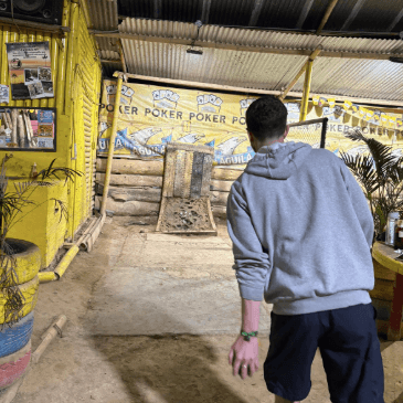 A travel friend playing Tejo, the national sport of Colombia