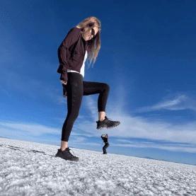 Alice stomping down on Cat perspective photo on the Uyuni Salt Flat