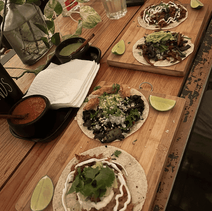 A surface with 2 plates of large tacos