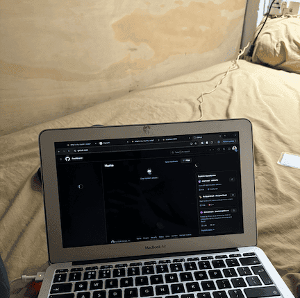 Laptop pictured in a bed